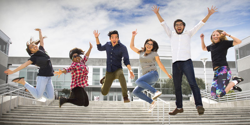Image of Students jumping.